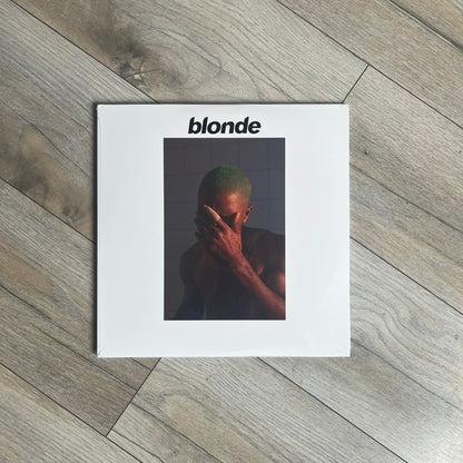 Frank Ocean “Blonde” 2x LP Vinyl Repress is a 2026 limited black double vinyl release presented in a gatefold sleeve. The set includes a 12" x 36" lyrics foldout and a 12" x 24" green foldout poster. It features two 12-inch records packaged in a minimalist white design consistent with the album’s aesthetic.