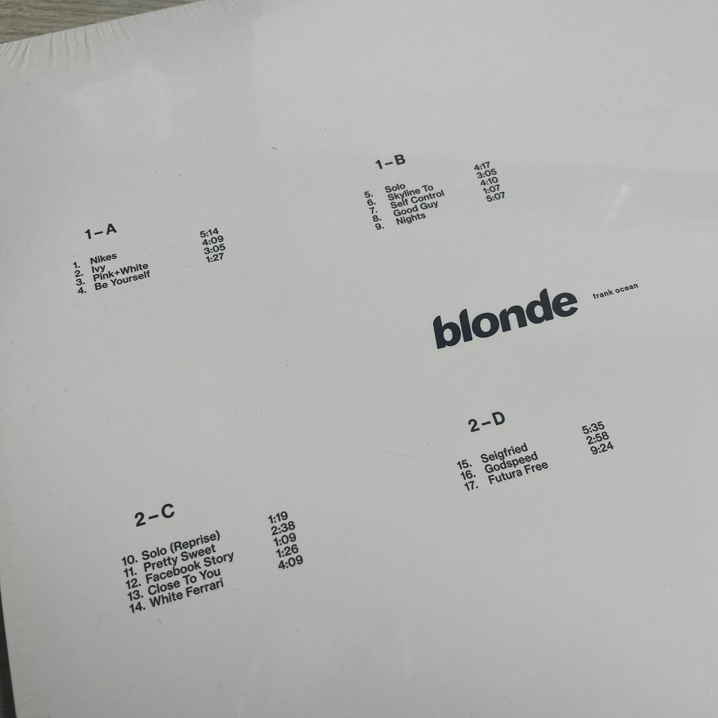 Frank Ocean “Blonde” 2x LP Vinyl Repress is a 2026 limited black double vinyl release presented in a gatefold sleeve. The set includes a 12" x 36" lyrics foldout and a 12" x 24" green foldout poster. It features two 12-inch records packaged in a minimalist white design consistent with the album’s aesthetic.
