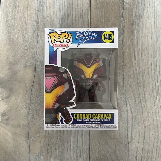 Funko Pop! Movies: Blue Beetle Conrad Carapax #1405 is a 2023 vinyl figure from the DC Blue Beetle (2023) movie line. It depicts Conrad Carapax in his armored design with a color scheme of deep maroon, bright yellow, and metallic accents. The figure is part of the standard 4-inch POP! vinyl series and features detailed sculpting based on the film character