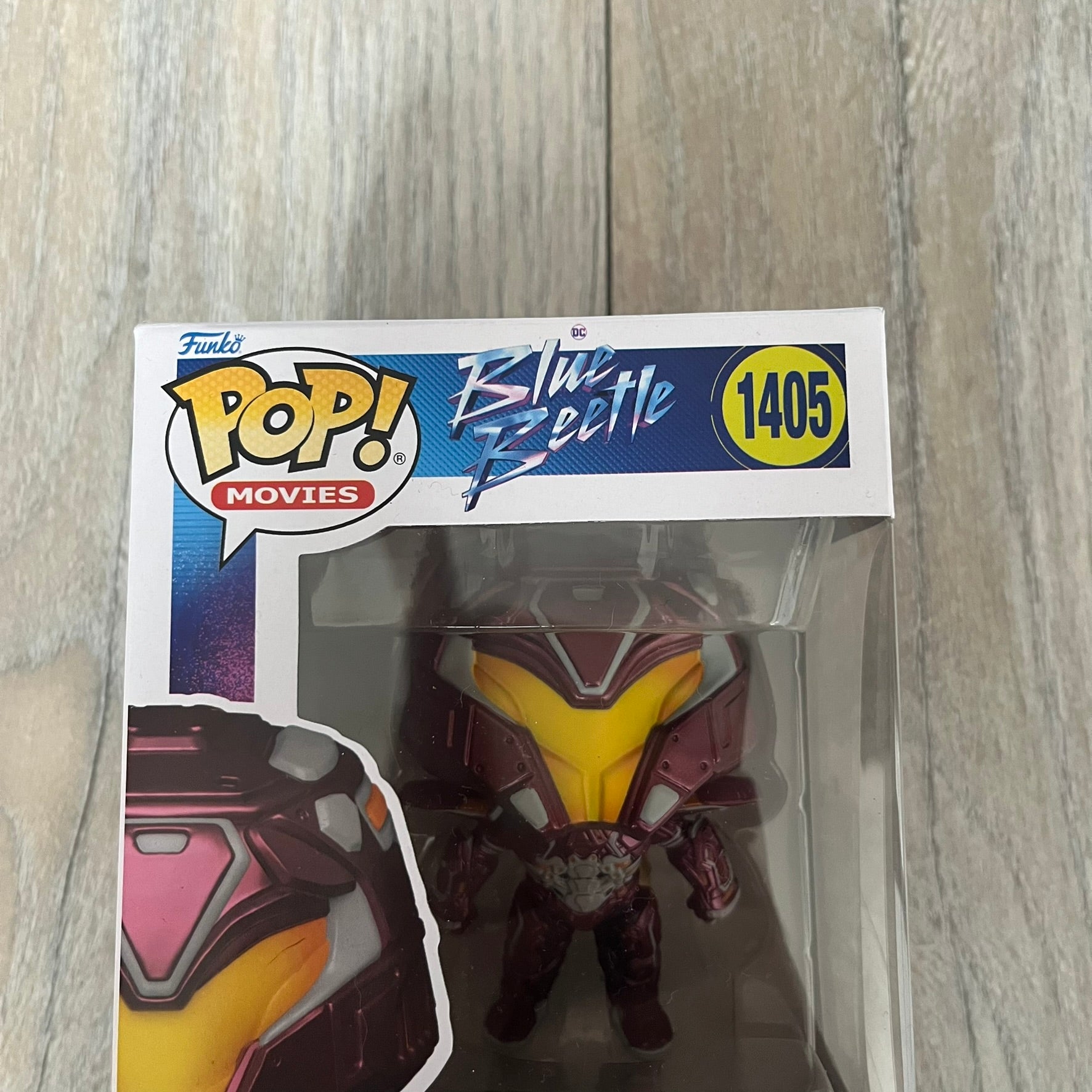 Funko Pop! Movies: Blue Beetle Conrad Carapax #1405 is a 2023 vinyl figure from the DC Blue Beetle (2023) movie line. It depicts Conrad Carapax in his armored design with a color scheme of deep maroon, bright yellow, and metallic accents. The figure is part of the standard 4-inch POP! vinyl series and features detailed sculpting based on the film character