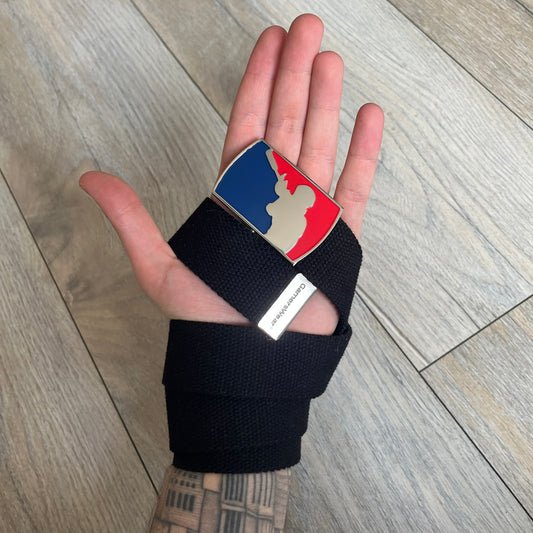 Gamerswear Counter-Strike 2016 Black Belt is a black cotton belt with an adjustable fit and a metal tip featuring a cutout Gamerswear logo. The buckle showcases an armed character in a silver finish, framed by blue enamel on the left side and red enamel on the right. The central figure is highlighted with a raised silver design and matching silver border detailing.