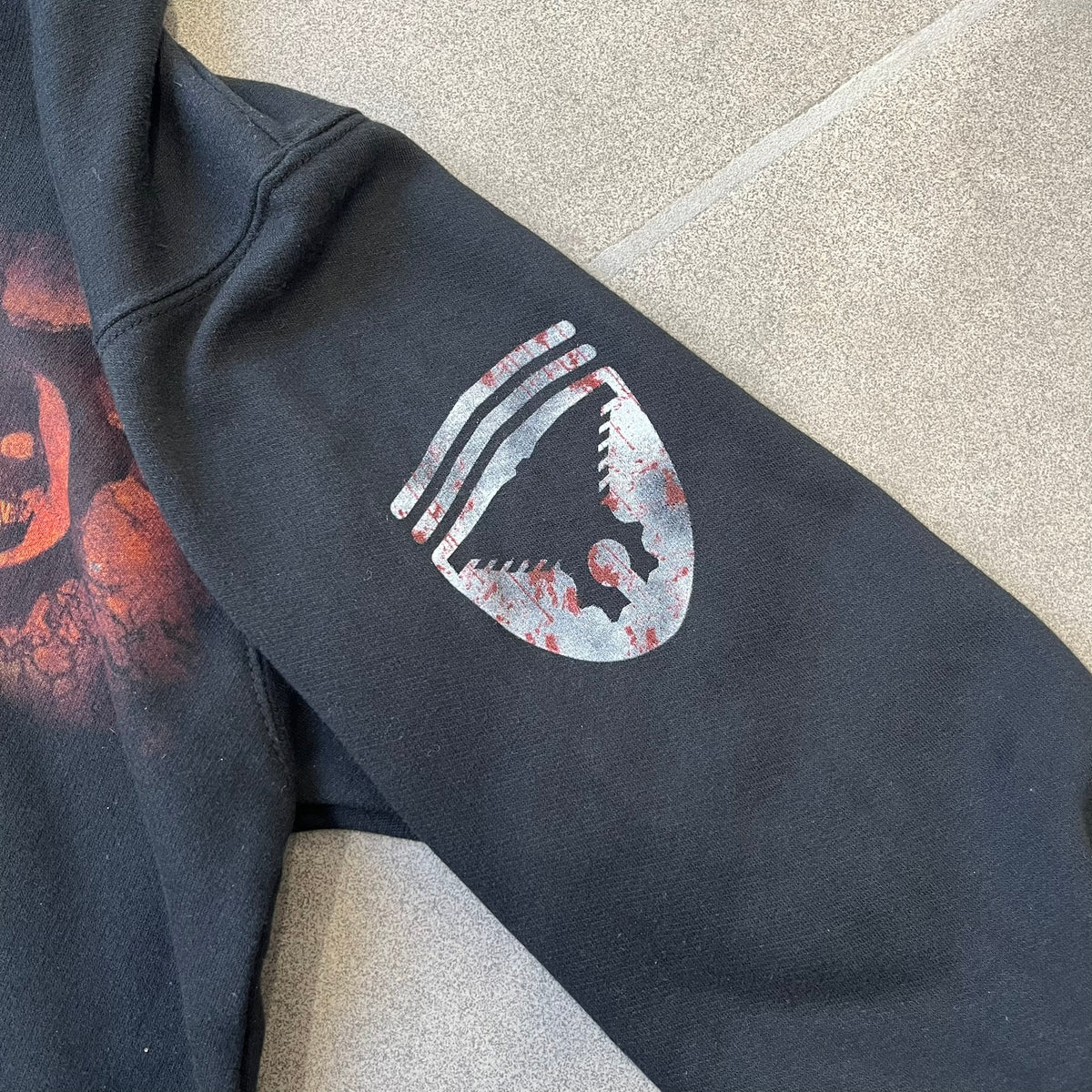 Gears of War 3 Marcus Fenix 2010 Promo Hoodie is a black zip-up hoodie with a dark Crimson Omen logo in orange tones on the left upper chest and a bloody Delta-One logo on one sleeve. The back features a large Marcus Fenix graphic with “Gears of War 3” text below it and a small 2010 Epic Games licensing mark.