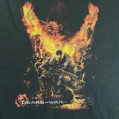 Black Gears of War Tee for Xbox 360 with a small red skull front logo on the chest and white Xbox 360 logo on the sleeve. The back features a full-color cover graphic with Marcus Fenix and branding of the game and Epic Games. Xbox tagged on the side, wash tag is faded.