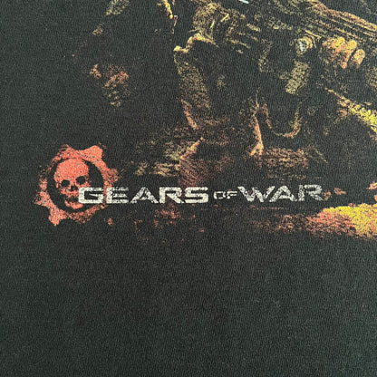 Black Gears of War Tee for Xbox 360 with a small red skull front logo on the chest and white Xbox 360 logo on the sleeve. The back features a full-color cover graphic with Marcus Fenix and branding of the game and Epic Games. Xbox tagged on the side, wash tag is faded.