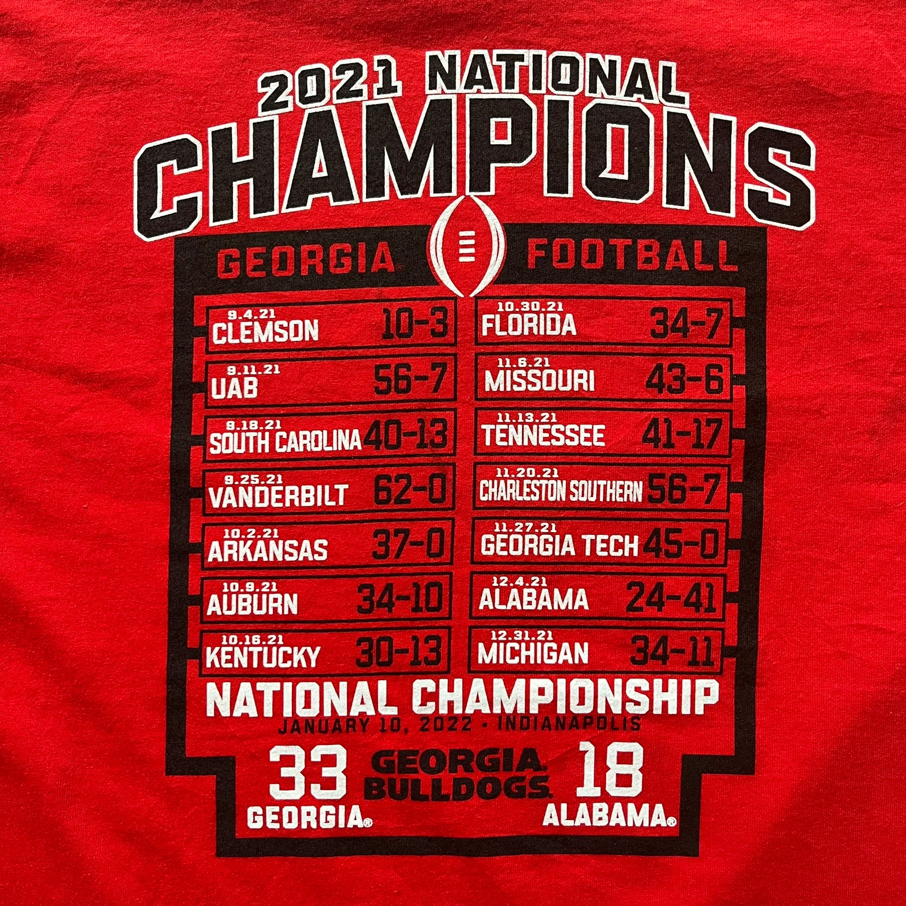 Red t-shirt celebrating the 2021 National Champions Georgia Football with a championship scoreboard.