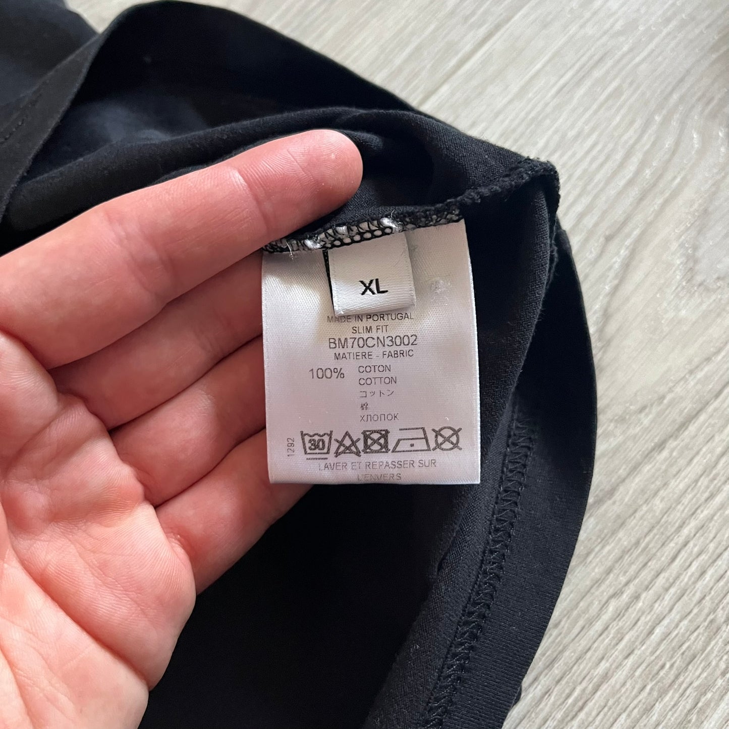 This Givenchy Distressed Black Stars Tee features the label’s iconic star motif from the FW18 season, with five stars across the front collar and four at the back. Crafted in Portugal from 100% cotton, it offers a slim fit and a soft, ribbed crewneck finish. A sought-after Givenchy stars shirt, and yes the distressed stars are intentional, not due to wear.