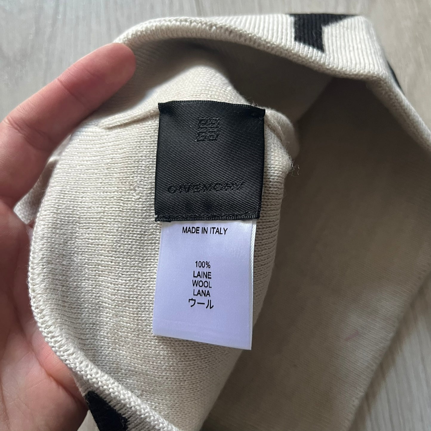 Beige Givenchy Jacquard beanie made from 100% wool and crafted in Italy. Features the black contrasting logo around the rolled brim, splitting “GIVE” and “NCHY” across the hem.&nbsp;Premium construction with a soft, comfortable fit.