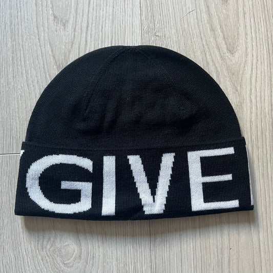 Black Givenchy Jacquard beanie made from 100% wool and crafted in Italy. Features the white contrasting logo around the rolled brim, splitting “GIVE” and “NCHY” across the hem. Premium construction with a soft, comfortable fit.
