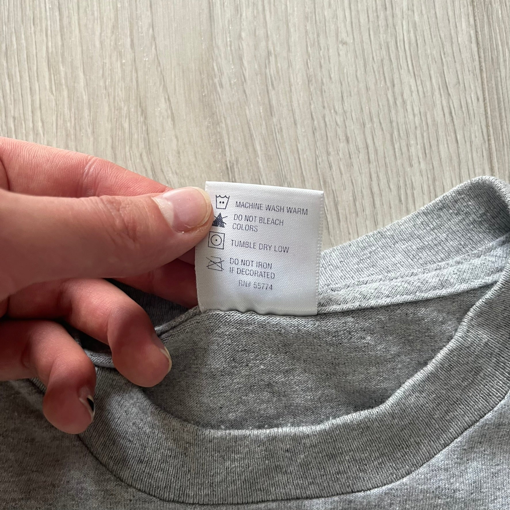 Gray “God Bless USA” tee on an Alstyle blank, made from soft, durable cotton. Embroidery showcases USA in flag colors with gold “God Bless” text and a subtle September 11, 2001 detail underneath. A respectful and collectible commemorative shirt.