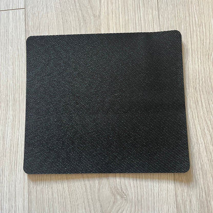 Official Rockstar Games Grand Theft Auto V "iFruit" Mouse Pad. Sleek black hard-plastic surface with a smooth, low-friction finish and the classic iFruit logo in color. Features a durable non-slip rubber base for stability and the Rockstar Games logo at the bottom. Originally available via the Rockstar Warehouse during GTAV’s release period.