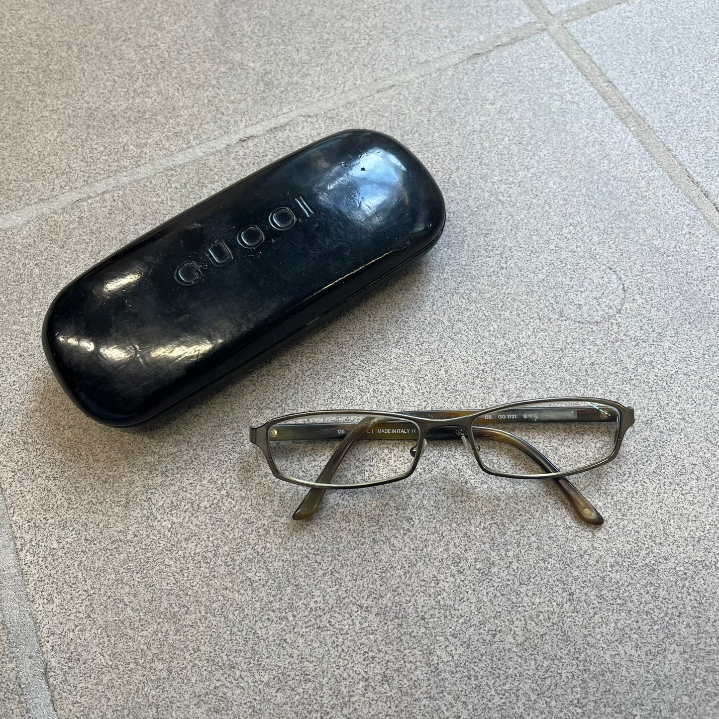 Gucci GG 1721 3U0 Brown Eyeglasses are a Made in Italy optical frame featuring a square full-rim design with a brown Havana-style colorway. The frames combine metal and plastic construction with a subtle Gucci logo detail on the front. Designed as a unisex model, they include prescription lenses and offer 100% UVA protection. Comes with an original black Gucci case.
