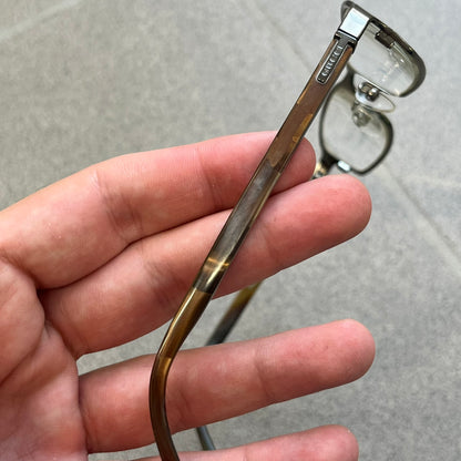 Gucci GG 1721 3U0 Brown Eyeglasses are a Made in Italy optical frame featuring a square full-rim design with a brown Havana-style colorway. The frames combine metal and plastic construction with a subtle Gucci logo detail on the front. Designed as a unisex model, they include prescription lenses and offer 100% UVA protection. Comes with an original black Gucci case.
