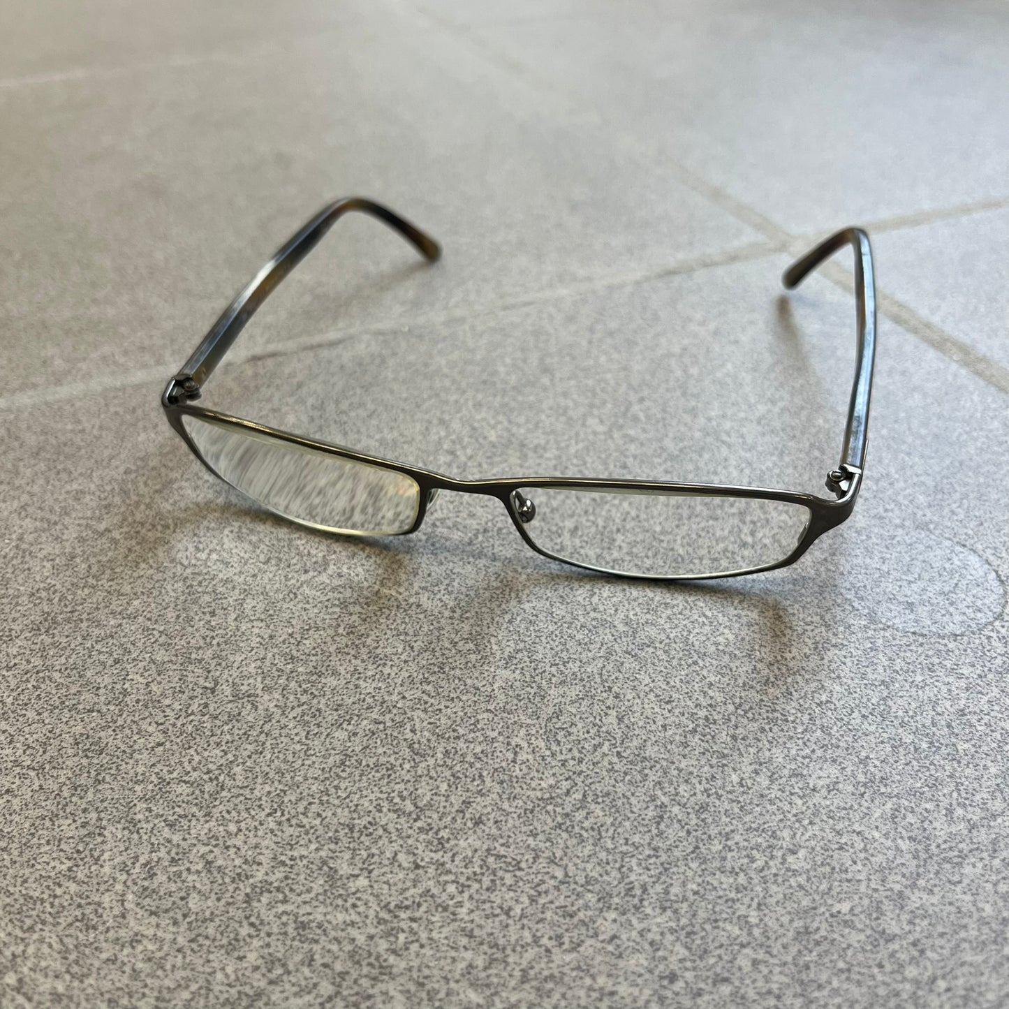 Gucci GG 1721 3U0 Brown Eyeglasses are a Made in Italy optical frame featuring a square full-rim design with a brown Havana-style colorway. The frames combine metal and plastic construction with a subtle Gucci logo detail on the front. Designed as a unisex model, they include prescription lenses and offer 100% UVA protection. Comes with an original black Gucci case.
