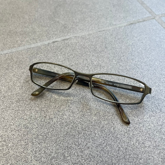 Gucci GG 1721 3U0 Brown Eyeglasses are a Made in Italy optical frame featuring a square full-rim design with a brown Havana-style colorway. The frames combine metal and plastic construction with a subtle Gucci logo detail on the front. Designed as a unisex model, they include prescription lenses and offer 100% UVA protection. Comes with an original black Gucci case.
