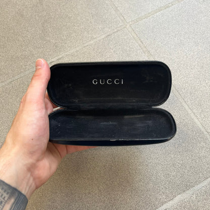 Gucci GG 1721 3U0 Brown Eyeglasses are a Made in Italy optical frame featuring a square full-rim design with a brown Havana-style colorway. The frames combine metal and plastic construction with a subtle Gucci logo detail on the front. Designed as a unisex model, they include prescription lenses and offer 100% UVA protection. Comes with an original black Gucci case.

