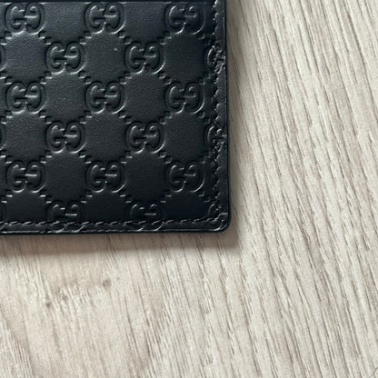 Gucci Microguccissima Black Cardholder crafted in Italy from premium black calf leather with the iconic Microguccissima pattern. Features five card slots, including a central compartment for bills or additional cards. Compact and refined, this Gucci leather card case combines durability with timeless design.
