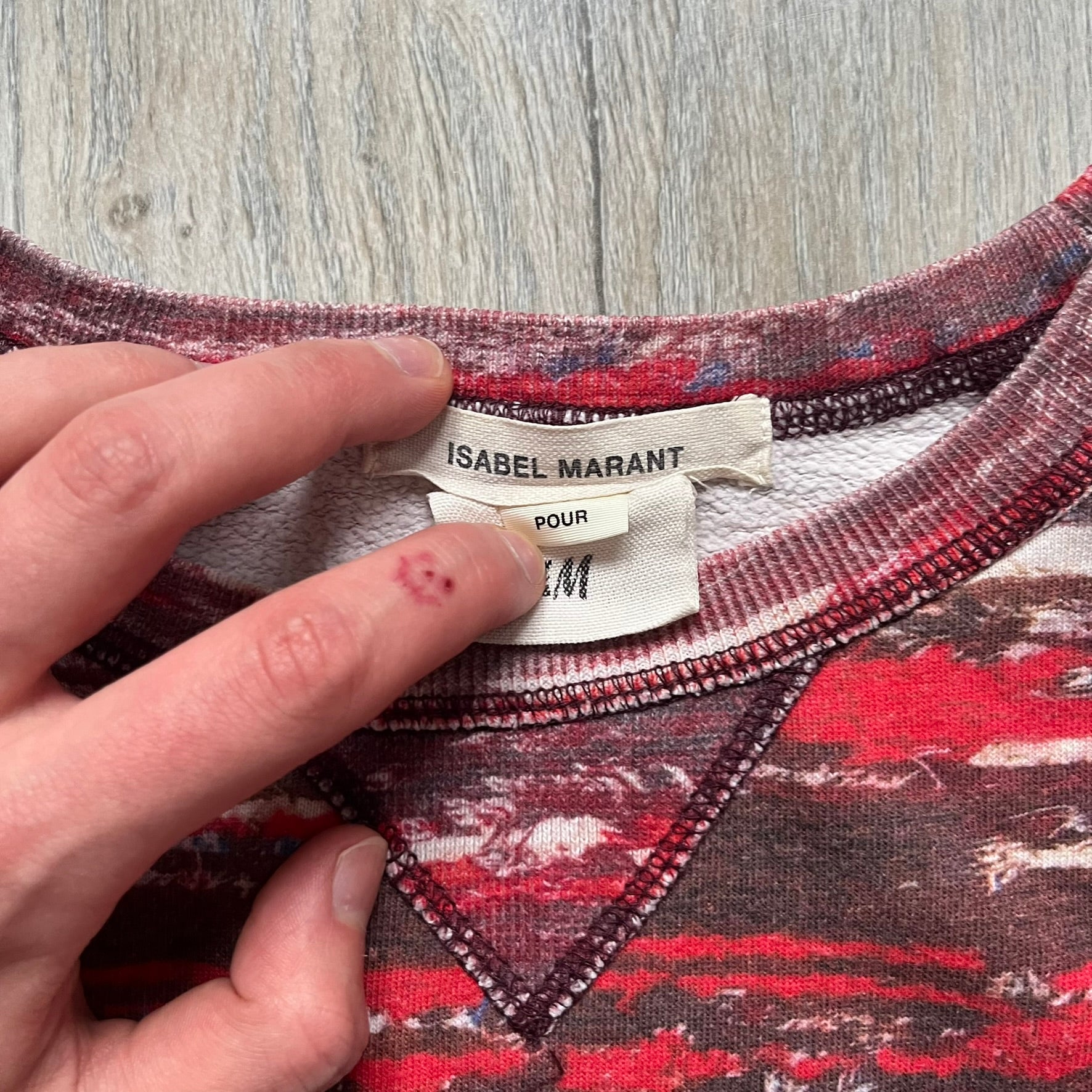 H&M x Isabel Marant 2013 Red Disorder Sweater is a women’s knit sweater in red, made from a soft fabric blend. The sweater features a deliberately distressed knit throughout, with ribbed cuffs and hem for structure. It was released as part of the H&M x Isabel Marant 2013 collaboration.