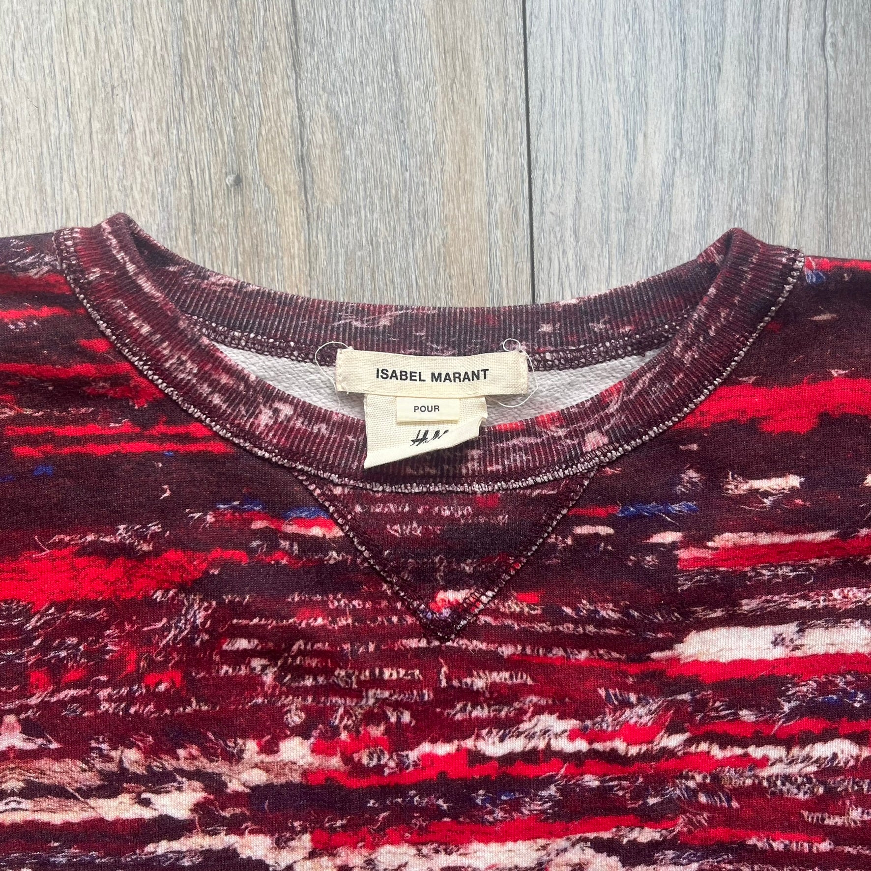 H&amp;M x Isabel Marant 2013 Red Disorder Sweater is a women’s knit sweater in red, made from a soft fabric blend. The sweater features a deliberately distressed knit throughout, with ribbed cuffs and hem for structure. It was released as part of the H&amp;M x Isabel Marant 2013 collaboration.&nbsp;