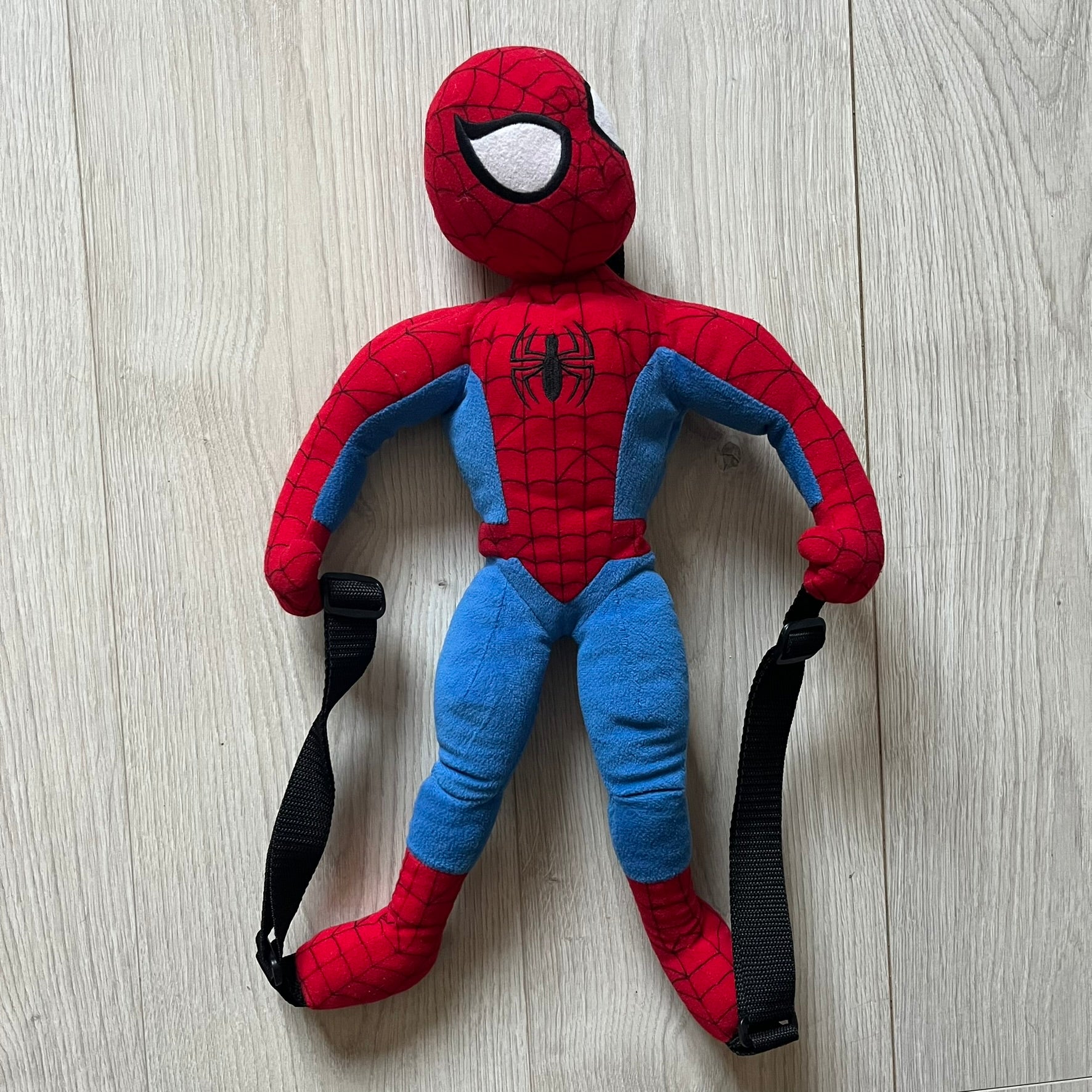 2006 H&amp;M x Marvel Spider-Man Backpack shaped as Spider-Man in his signature red and blue outfit. Features a compact back pocket and unique strap placement connecting his hands to his legs. Rare early 2000s collaboration collectible.