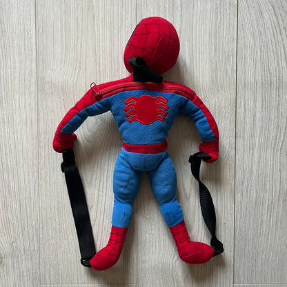 2006 H&M x Marvel Spider-Man Backpack shaped as Spider-Man in his signature red and blue outfit. Features a compact back pocket and unique strap placement connecting his hands to his legs. Rare early 2000s collaboration collectible.