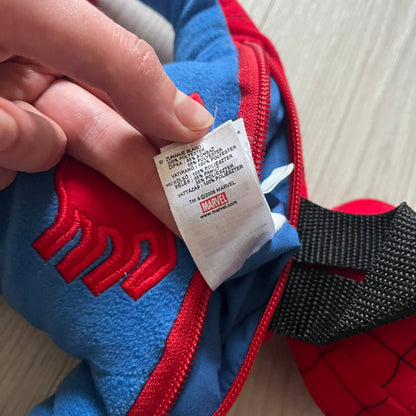 2006 H&M x Marvel Spider-Man Backpack shaped as Spider-Man in his signature red and blue outfit. Features a compact back pocket and unique strap placement connecting his hands to his legs. Rare early 2000s collaboration collectible.