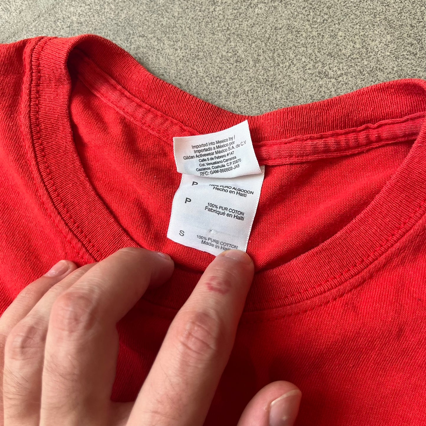 Halo 3 Grunt Emblem 2007 Red Tee features a red T-shirt made on a Gildan blank. The front has a large white and black Grunt emblem graphic, with a small Halo 3 logo below it on the right and Microsoft 2007 licensing text below it on the left. Made from 100% cotton.
