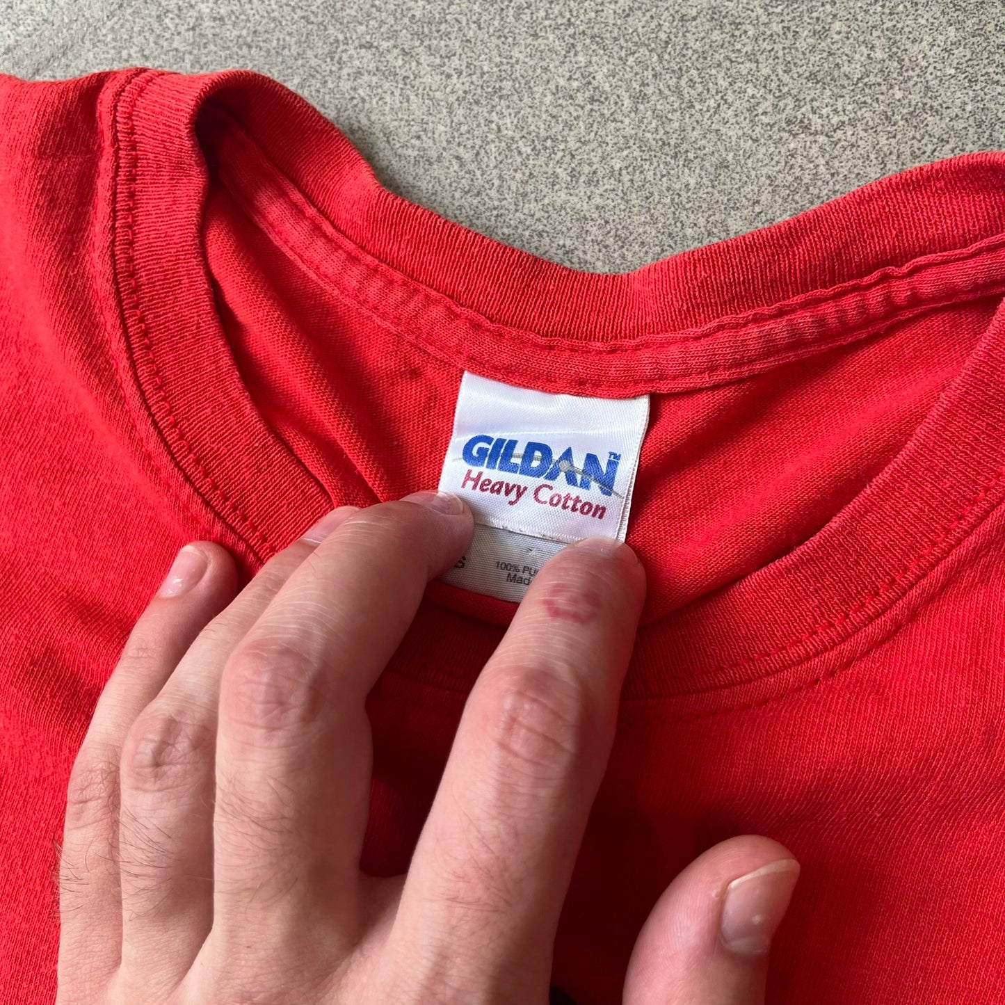 Halo 3 Grunt Emblem 2007 Red Tee features a red T-shirt made on a Gildan blank. The front has a large white and black Grunt emblem graphic, with a small Halo 3 logo below it on the right and Microsoft 2007 licensing text below it on the left. Made from 100% cotton.
