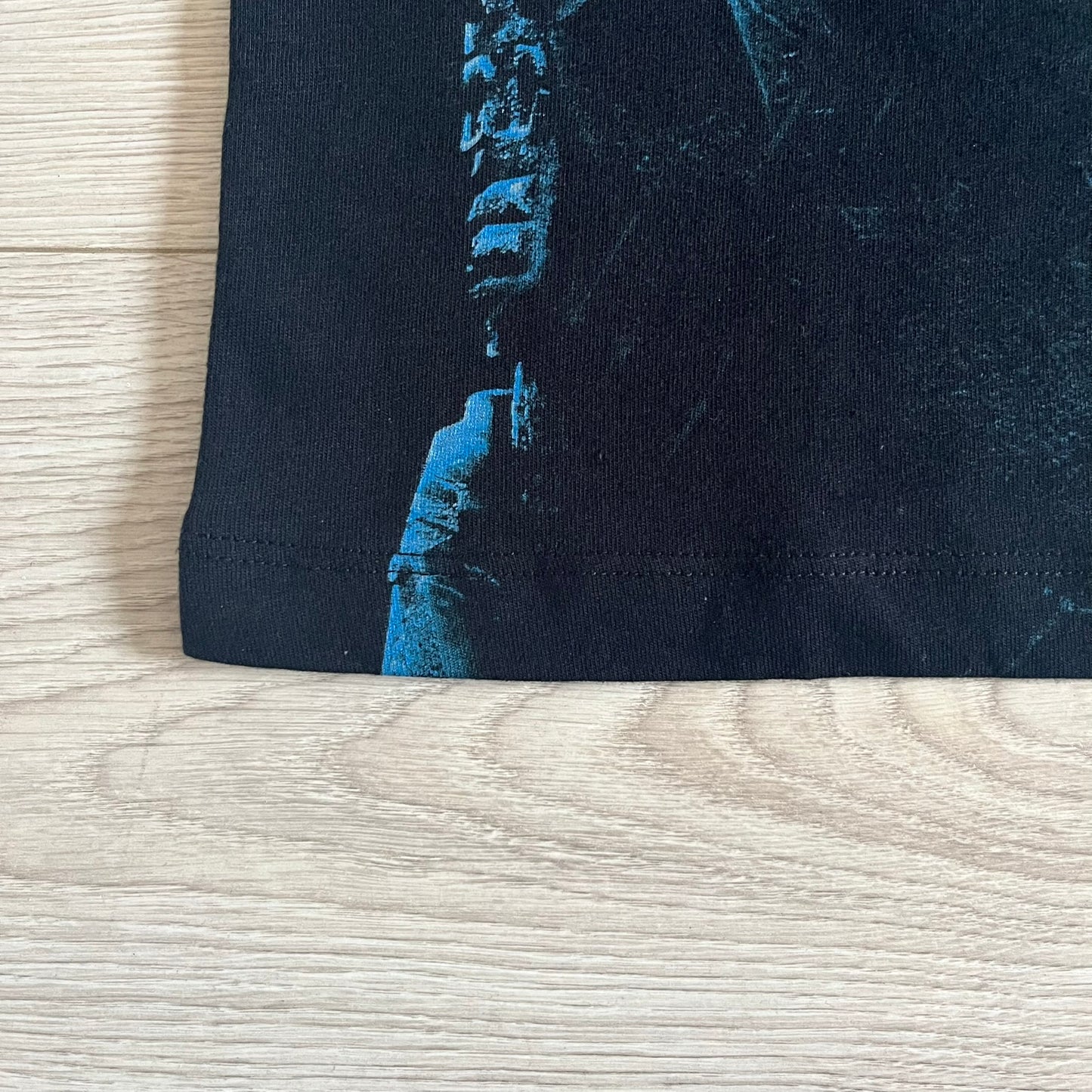 Black Halo 3: ODST Tee for Xbox 360 featuring a large blue Master Chief graphic on the front right and a small logo on the left chest. Made from high-quality cotton with Xbox 360 tags on the collar and a green one on the side. A super rare collectible for Halo fans.