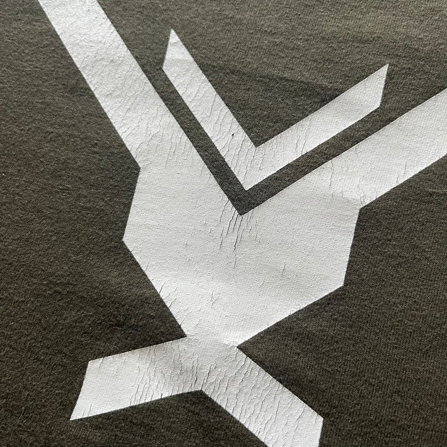 Khaki Halo Reach tee on a Sol’s blank featuring the Noble Team emblem in white on the front and the Halo Reach logo beneath. Small Xbox 360 logo embroidered under the back collar. A classic collectible for fans of the iconic game series.