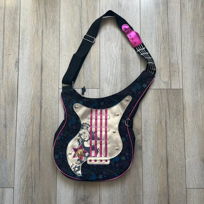 Hannah Montana 2000s Guitar-Shaped Shoulder Bag is a guitar-shaped bag with a black main body. The shoulder strap features pink glossy detailing and white string-like elements. The front panel has a multicolor pattern with stars, flowers, and butterflies. A large silver patch with pink string details and Hannah Montana graphics is placed on the front. The zipper pull is shaped with a Hannah Montana series logo design.
