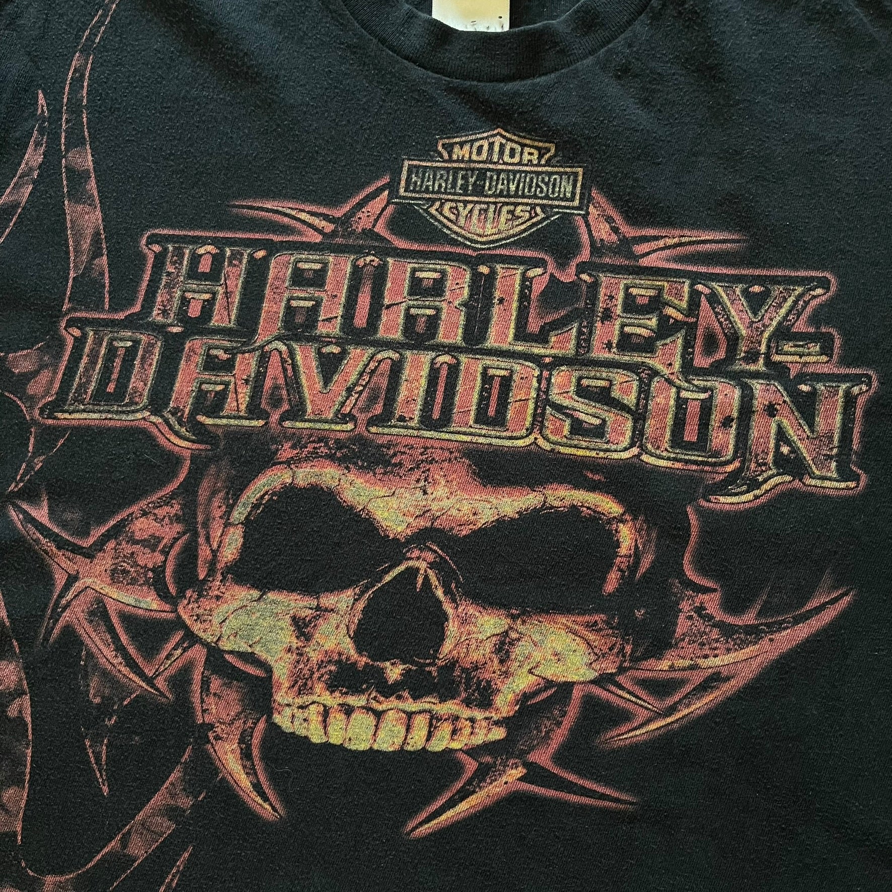 Black Harley Davidson t-shirt from 2011 with striking skull and Harley branding on the chest. Back print features the Stavenger Norway logo and date for an authentic rally vibe. Perfect for fans of vintage motorcycle style.