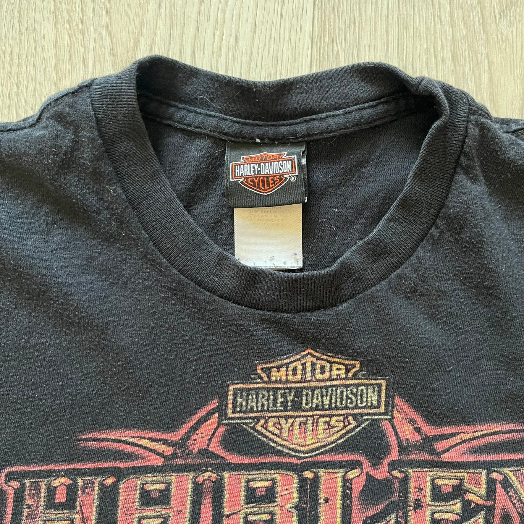 Black Harley Davidson t-shirt from 2011 with striking skull and Harley branding on the chest. Back print features the Stavenger Norway logo and date for an authentic rally vibe. Perfect for fans of vintage motorcycle style.