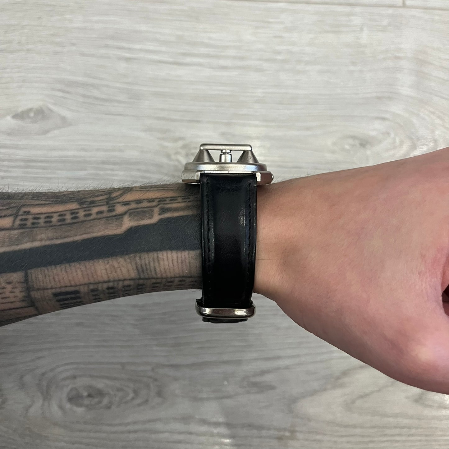 Hi-Tek Alexander “Jump Hour” 90's Analog Watch with a rare octagonal steel case and innovative rotation disc display. Hours appear in the left window and minutes in the right, revealed by the unique turnable cover. Made in England, this vintage 1990s watch features a chrome-plated stainless steel case, genuine leather strap, and an original design by Alexander Tasou of Hi-Tek Designs London. A true collector’s piece that is no longer in production.