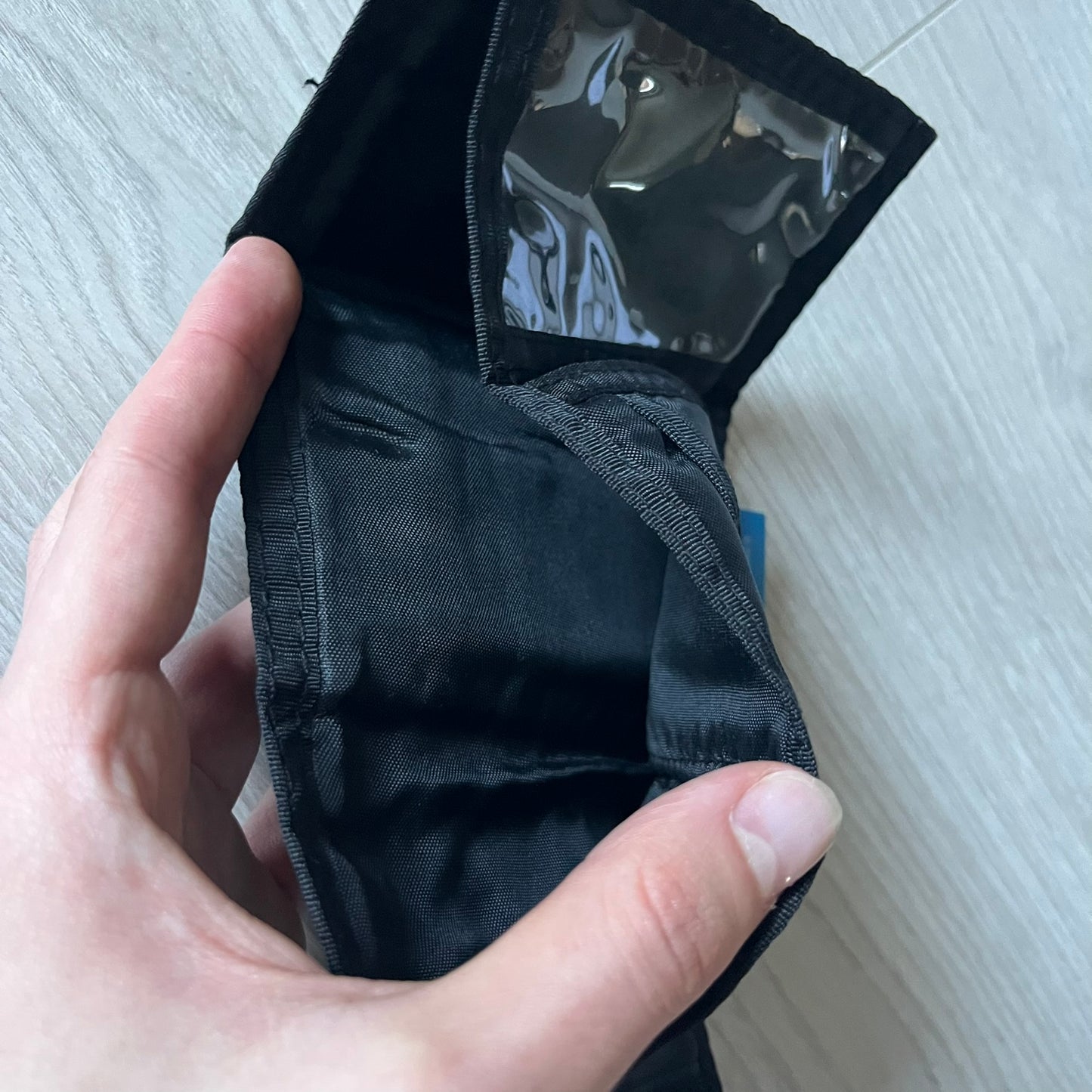 2008 Hot Wheels 24/Seven wallet in black with a detailed blue 24/Seven Car graphic under a protective plastic laminate. Includes Hot Wheels logo detailing, Mattel tags, and plenty of compartments for storage. A functional piece with nostalgic collector appeal.