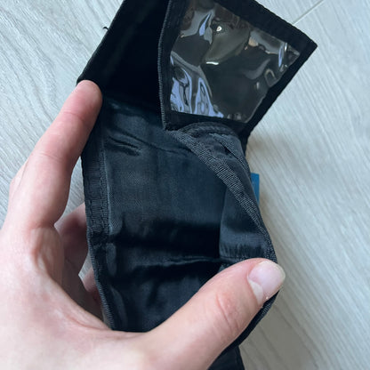 2008 Hot Wheels 24/Seven wallet in black with a detailed blue 24/Seven Car graphic under a protective plastic laminate. Includes Hot Wheels logo detailing, Mattel tags, and plenty of compartments for storage. A functional piece with nostalgic collector appeal.