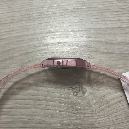 Close-up of a watch band on a wooden surface.