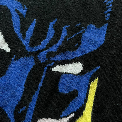 Iceberg Batman 2016 Black Sweater crafted from a premium blend of polyamide, wool, cashmere, and viscose. Features a large woven Batman comic-style graphic on a yellow background with the quote “I’ve got to find him before it’s too late.” Officially licensed by DC, released as part of the Spring/Summer 2016 collection.