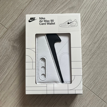 Nike Air Max 90 card wallet packaging on a wooden surface