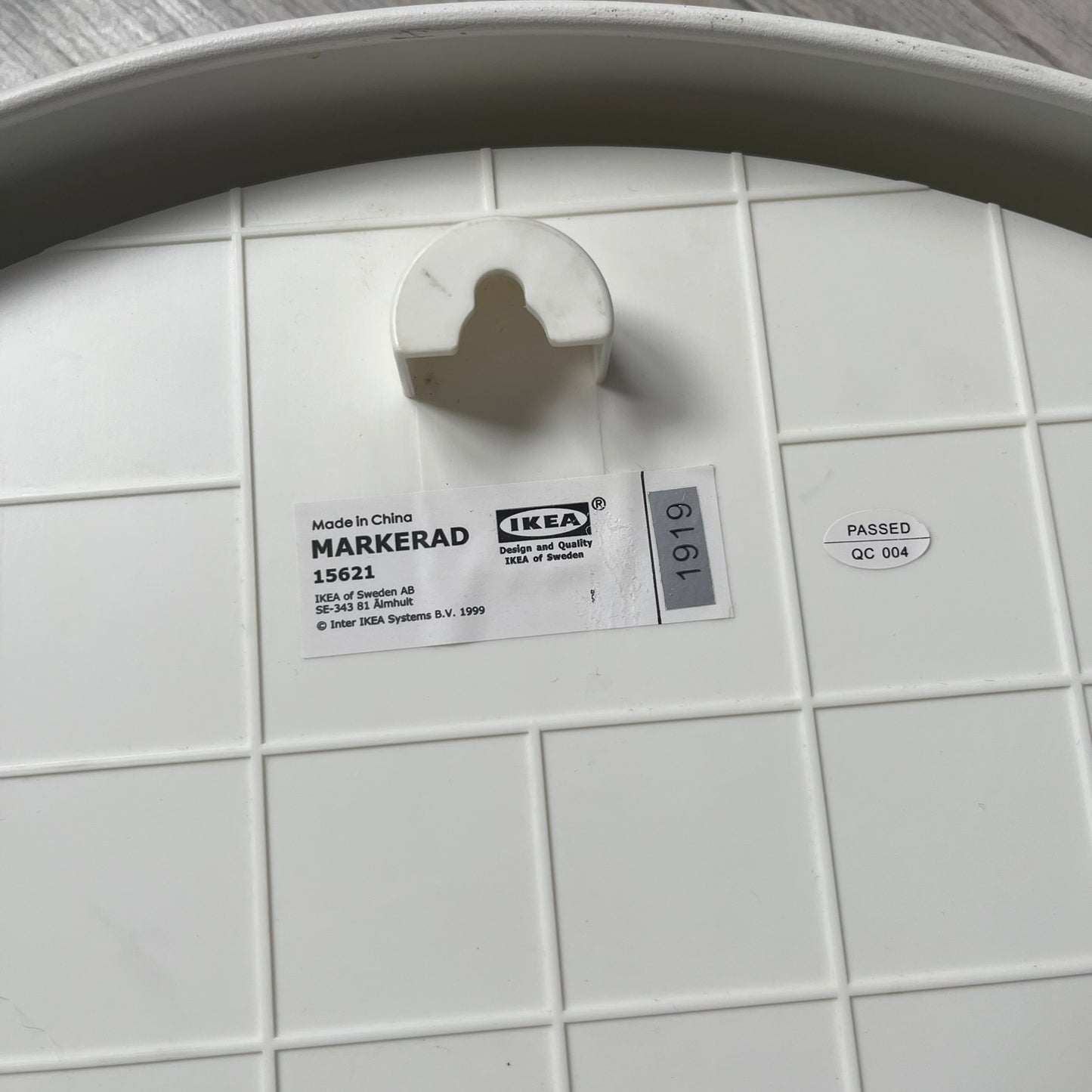 Ikea MARKERAD x Virgil Abloh “Temporary” Wall Clock is a white minimalist wall clock released on November 1, 2019 as part of the IKEA MARKERAD collaboration. It features a clean all-white design with a plexiglass cover and the word “TEMPORARY” printed across the face. The dial has no numerals, using only simple hour, minute, and second hands for time display.