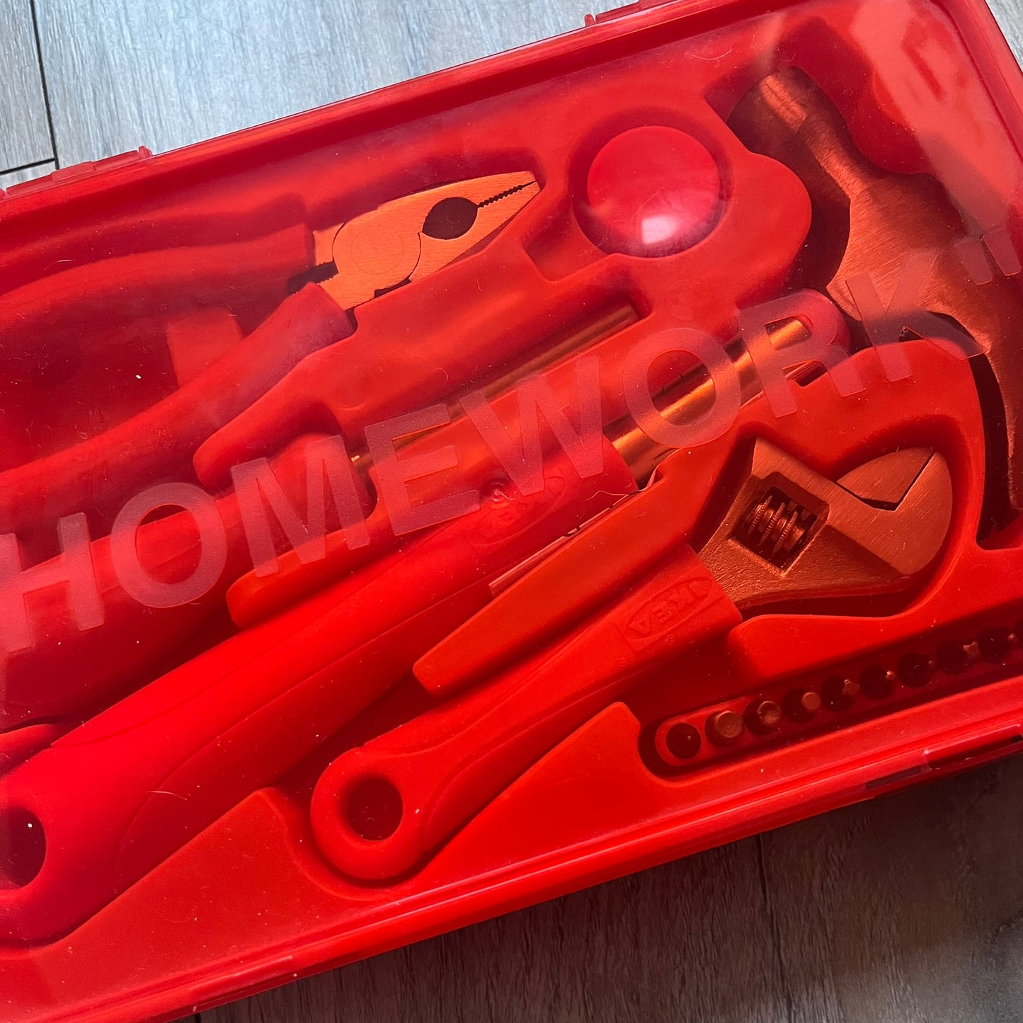 Orange/red toolkit from IKEA x Virgil Abloh MARKERAD collection, released 11/01/2019. Includes four tools: hammer, screwdriver, pliers, and wrench, all in matching orange/red color. Original IKEA release, part of the limited MARKERAD capsule.