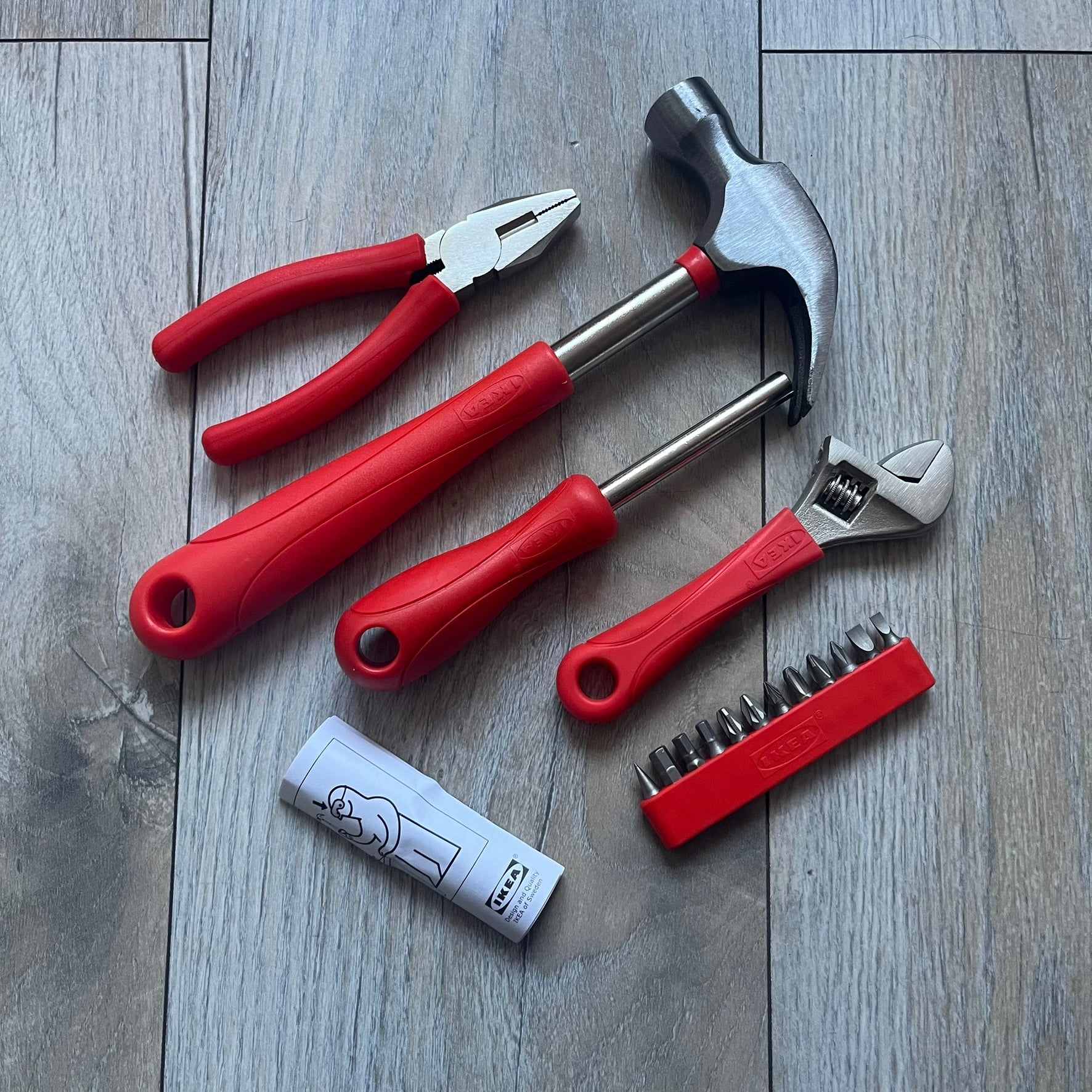 Orange/red toolkit from IKEA x Virgil Abloh MARKERAD collection, released 11/01/2019. Includes four tools: hammer, screwdriver, pliers, and wrench, all in matching orange/red color. Original IKEA release, part of the limited MARKERAD capsule.