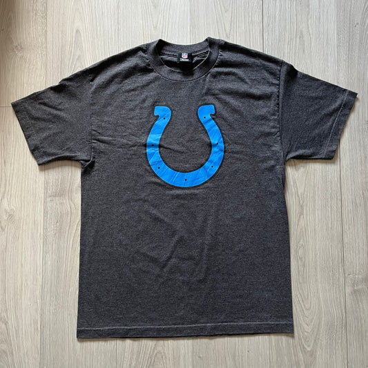 Gray t-shirt with blue logo on a wooden surface