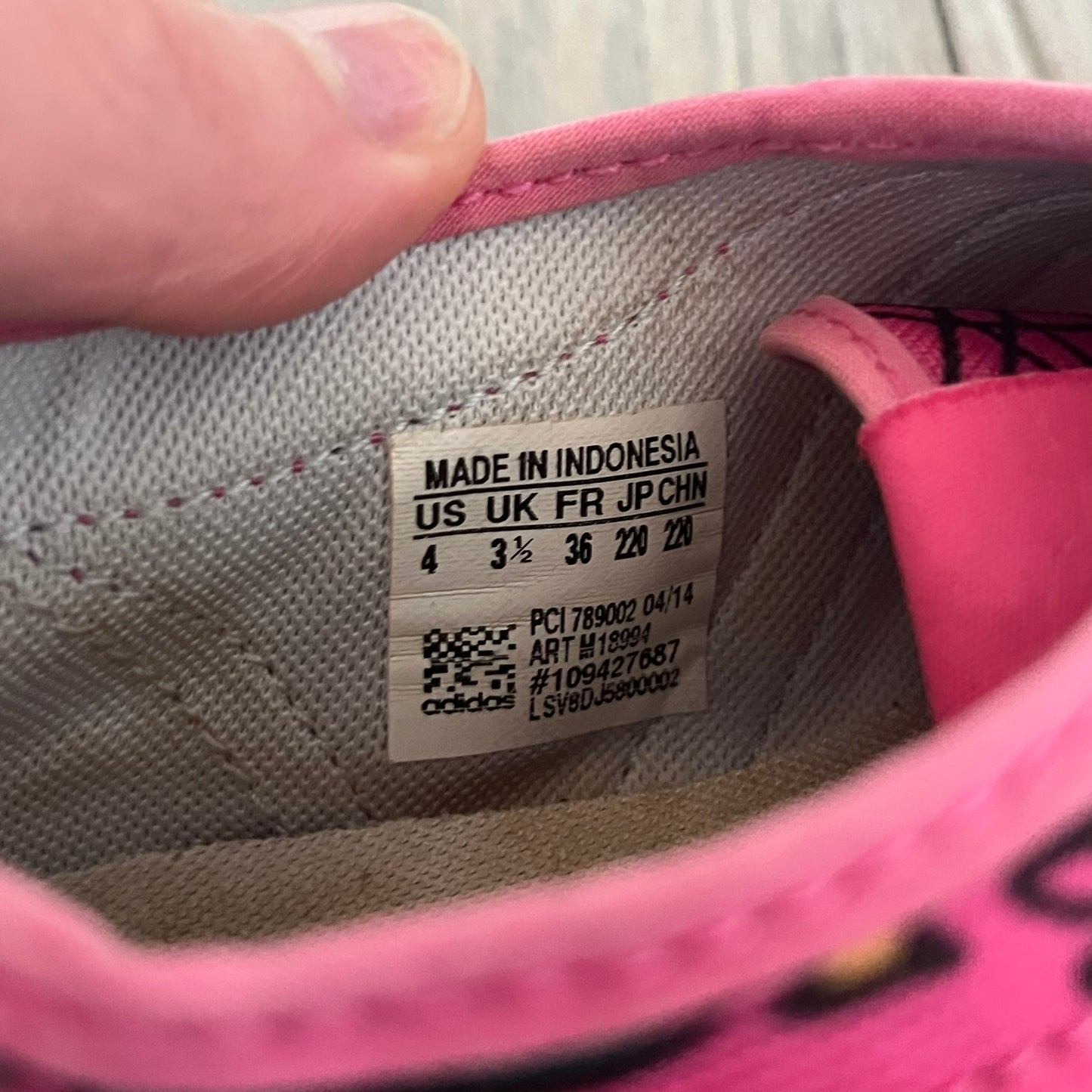 Jeremy Scott x adidas 2014 P-Sole “Pink” Sneakers feature a pink canvas upper with white leather adidas stripes and multicolored graphic prints. Released in 2014, they are part of the P-Sole line in the collaboration between adidas Originals, Jeremy Scott, and Kenny Scharf. The shoes include standard rubber soles and lace-up closure.