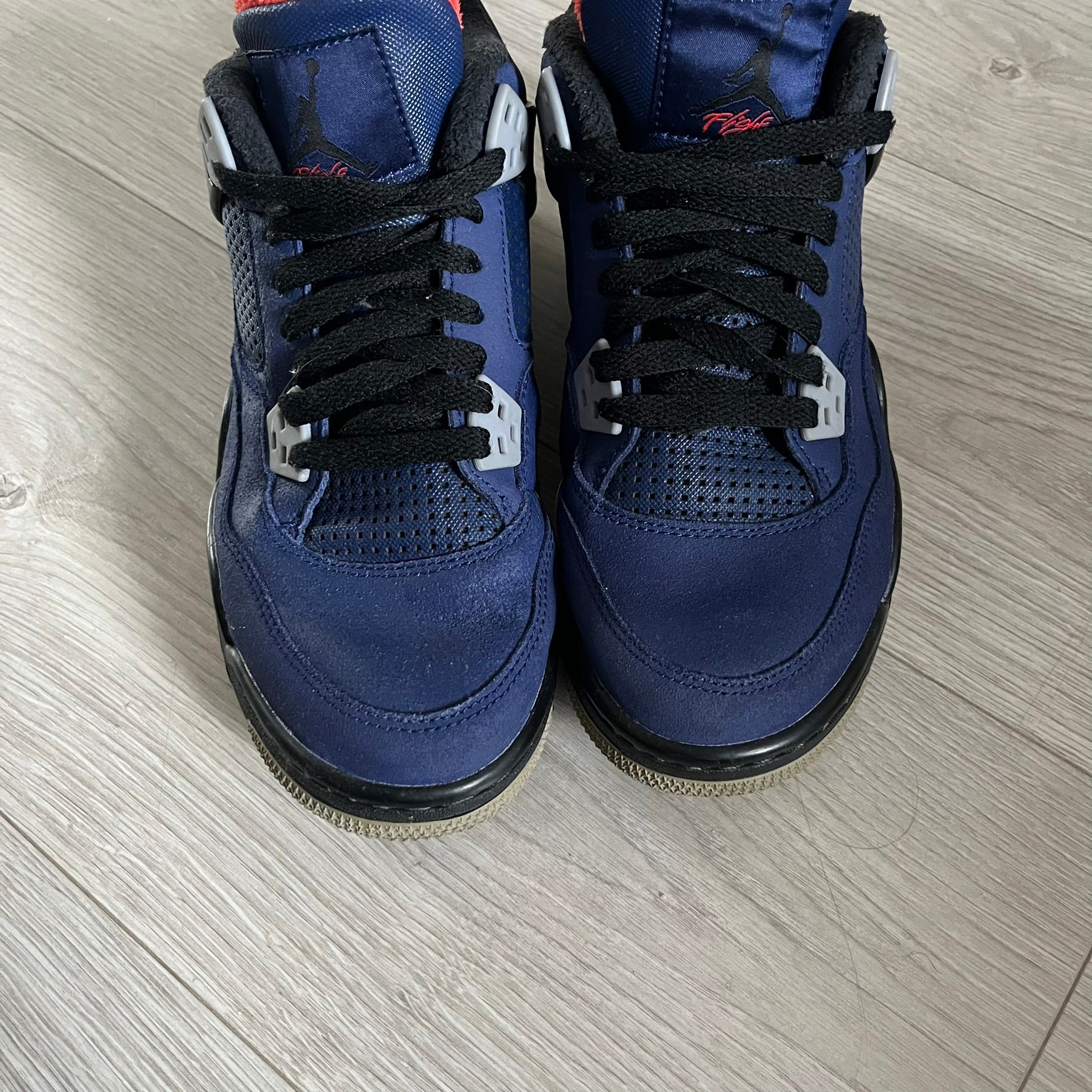 The Air Jordan 4 Retro Winterized “Loyal Blue” (CQ9745-401) reimagines the classic silhouette with a cold-weather upgrade. Crafted in premium Loyal Blue leather with rubberized panels and fleece-lined interiors for added warmth, it combines performance with rugged luxury. Released in December 2019, this model channels the look of the rare “Eminem Encore” 4s, making it a standout piece in the Jordan lineup.