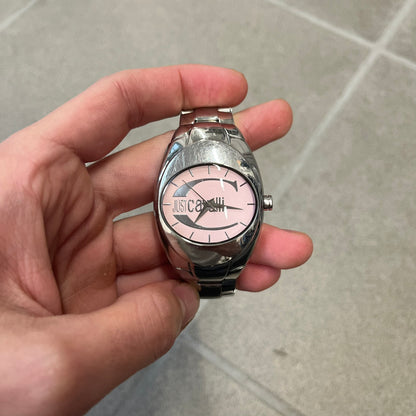 Just Cavalli 2010’s Pink Dial Analog Watch is a stainless steel watch with a raised oval case and an oval pink dial with a large silver Just Cavalli logo. The clasp is Just Cavalli branded, and the watch comes with its box and papers.