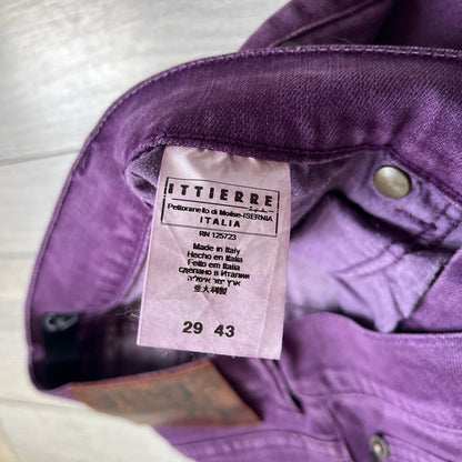 Just Cavalli 2010s Purple Slim Jeans are slim-fit denim jeans finished in a full purple colorway. The pair features classic front and back pocket construction, branded metal button closure, and small metal stud details on the pockets. Additional details include a rear leather Just Cavalli logo patch, interior Just Cavalli tag, and original paper tag.