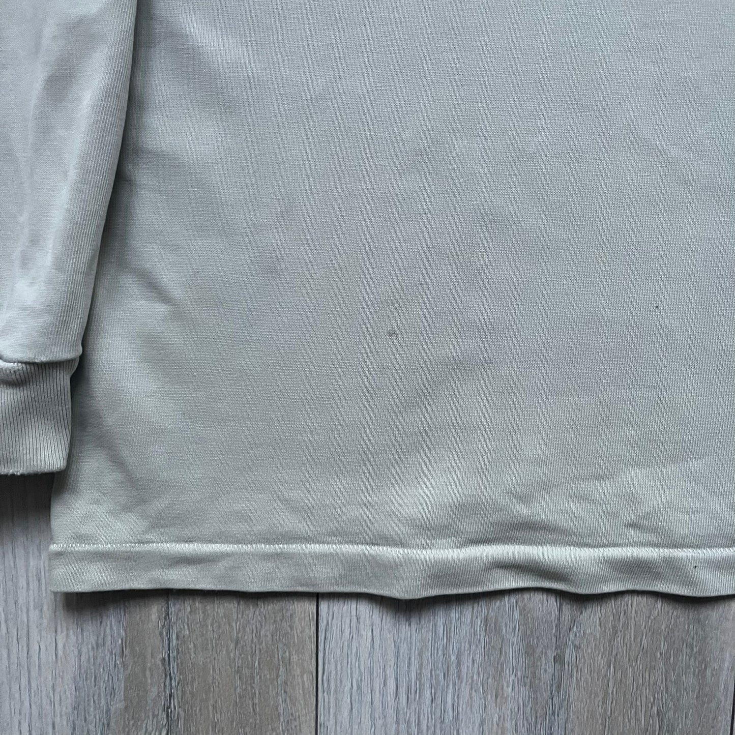 Longsleeve tee from the FW18 Kanye West x Pornhub collection, released 09/07/2018. Vapor color, featuring a front illustration of Riley Reid with her name above and “Top Female Performer” below. Back has the numbers “6918” (futuristic theme set in the year 6918). Includes printed Pornhub tag and YEEZY wash tag, part of a limited run commemorating the 2018 Pornhub Awards.