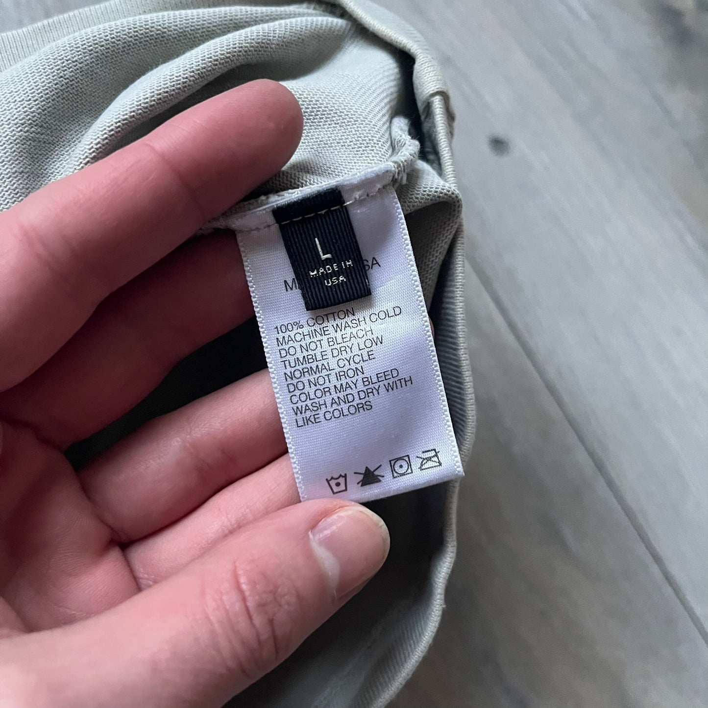 Longsleeve tee from the FW18 Kanye West x Pornhub collection, released 09/07/2018. Vapor color, featuring a front illustration of Riley Reid with her name above and “Top Female Performer” below. Back has the numbers “6918” (futuristic theme set in the year 6918). Includes printed Pornhub tag and YEEZY wash tag, part of a limited run commemorating the 2018 Pornhub Awards.