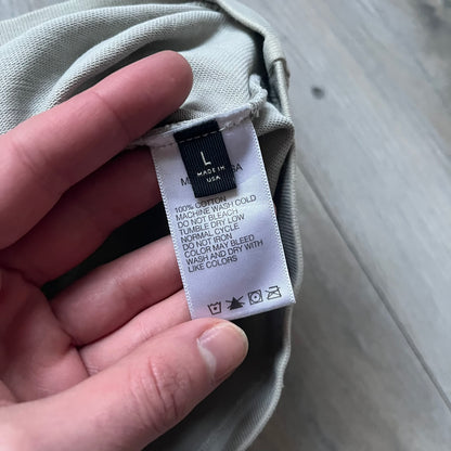 Longsleeve tee from the FW18 Kanye West x Pornhub collection, released 09/07/2018. Vapor color, featuring a front illustration of Riley Reid with her name above and “Top Female Performer” below. Back has the numbers “6918” (futuristic theme set in the year 6918). Includes printed Pornhub tag and YEEZY wash tag, part of a limited run commemorating the 2018 Pornhub Awards.