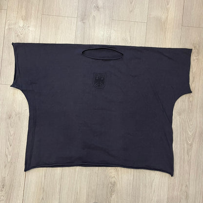 Kanye West Vultures Box Tee in navy features a large Vultures Eagles logo on the back and a smaller matching logo on the chest. Designed with an oversized, boxy silhouette, this T-shirt offers a relaxed fit. Made from high-quality, durable materials, it provides comfort for everyday wear while showcasing Yeezy’s distinctive style.